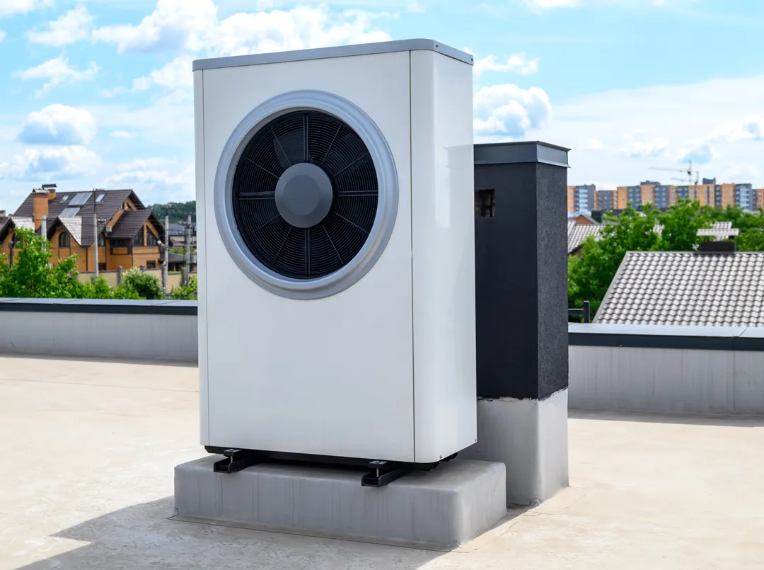 Air source heat pump installed on a flat roof